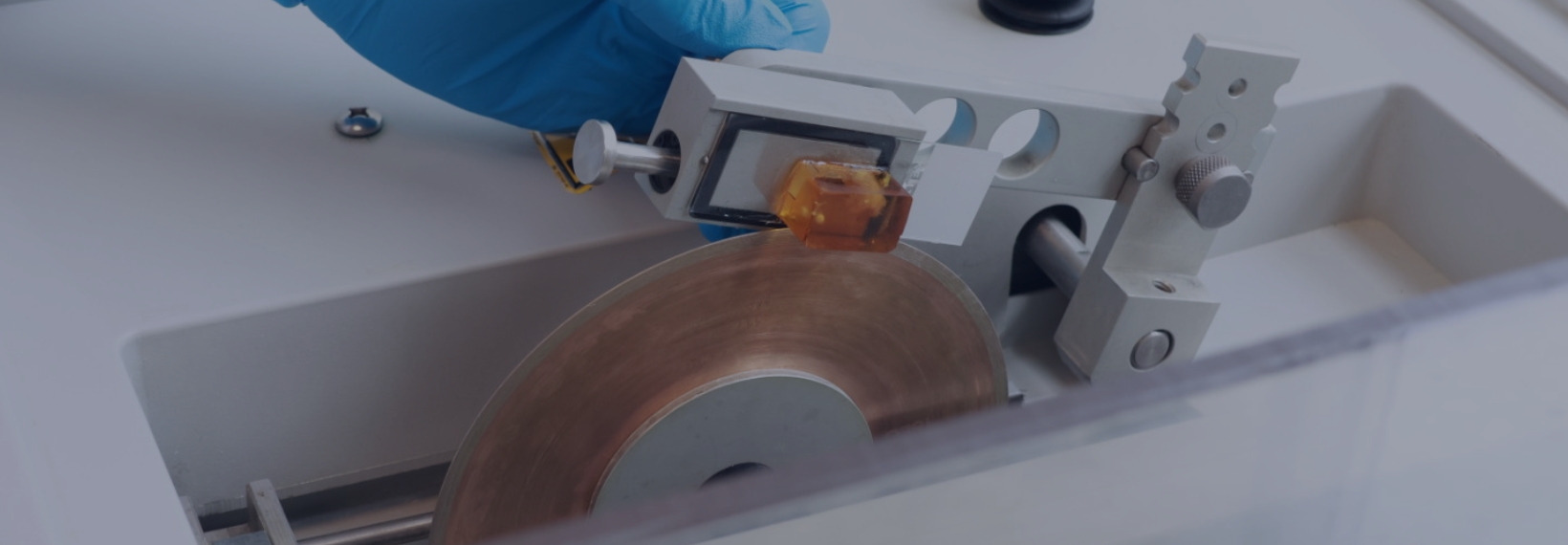 Resin block being cut with a saw